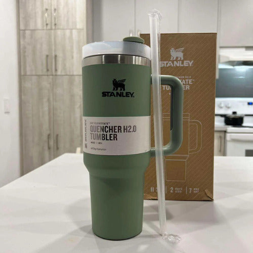 Green Stanley tumbler with a straw